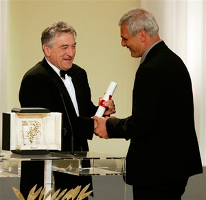 American actor Robert De Niro, left, presents the Palme d'Or for best film to French director Laurent Cantet/ AP